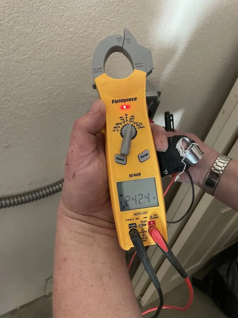 Voltage testing with clamp meter during Outlet Installation in Chenango